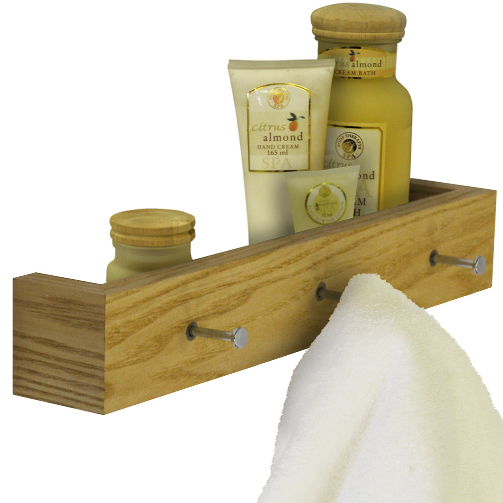 Oak floating shelf with three hooks for storage